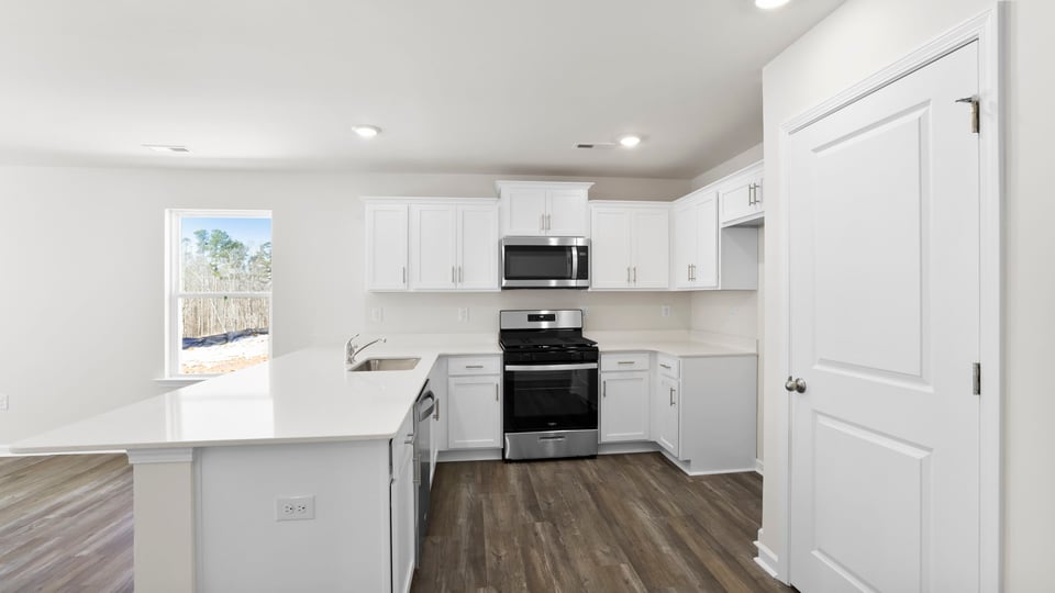 Kitchen with quartz countertops.