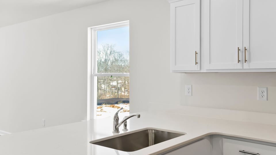 Kitchen with quartz countertops.