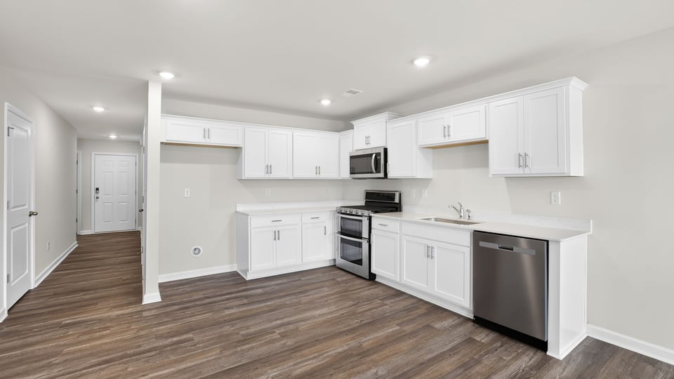 Kitchen with island and cabinets.