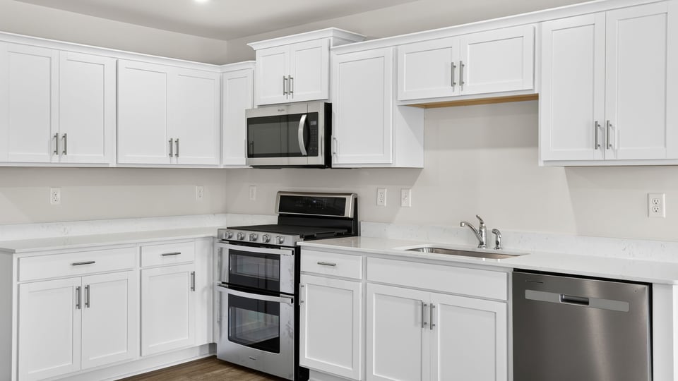 Kitchen with island and cabinets.