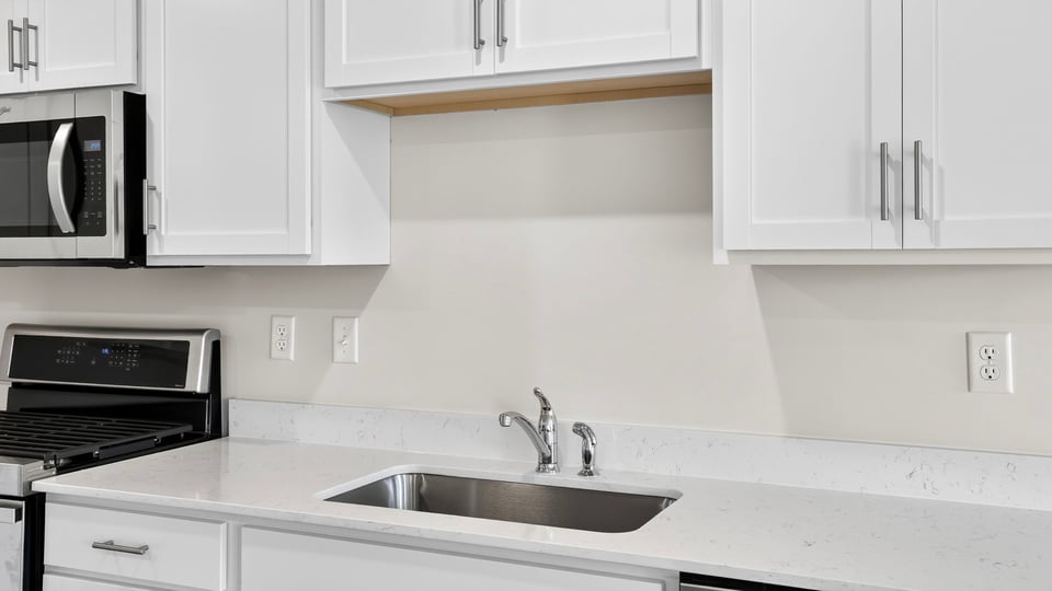 Kitchen with island and cabinets.
