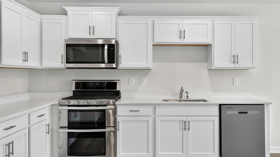 Kitchen with island and cabinets.