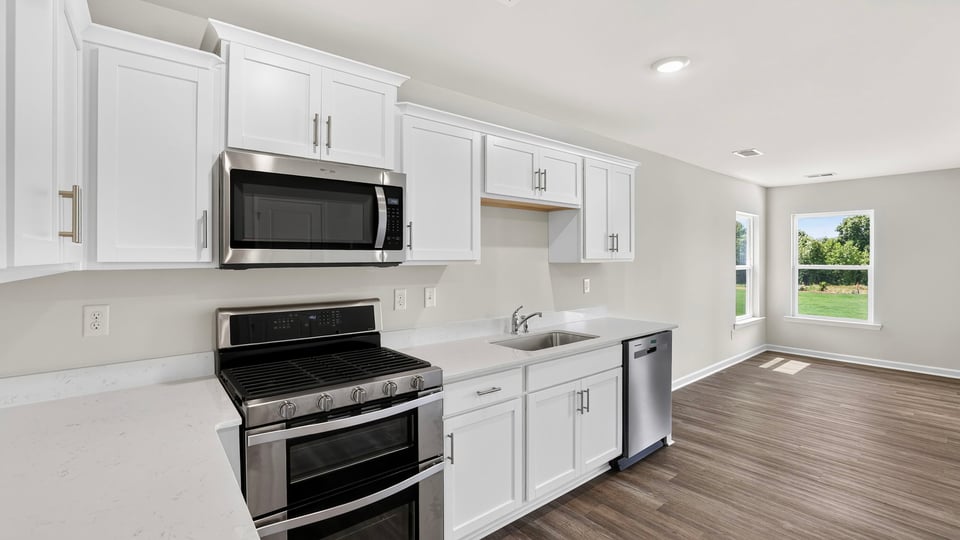 Kitchen with island and cabinets.
