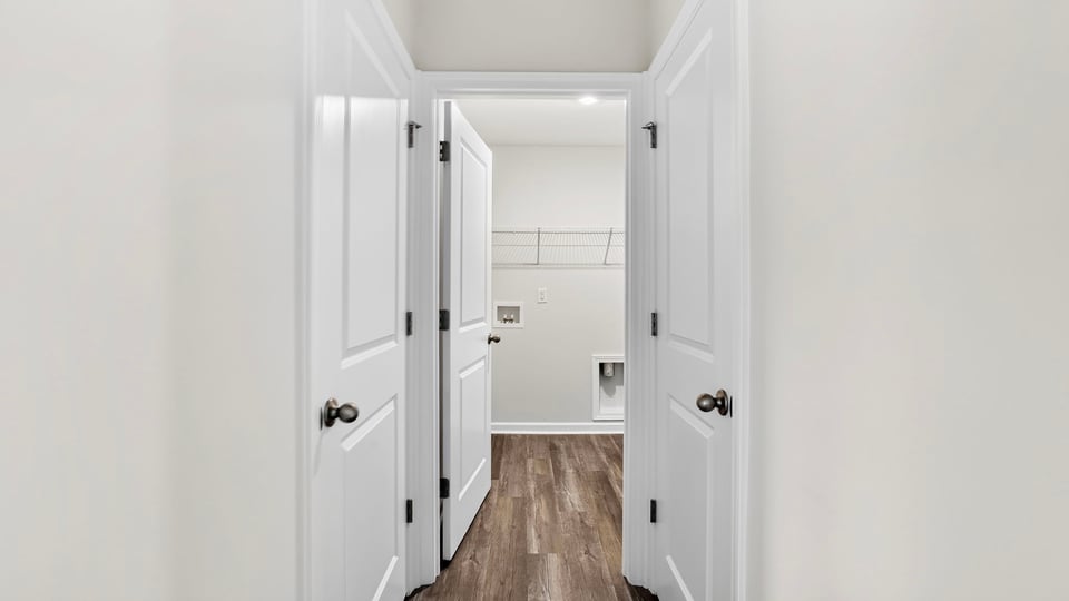 Primary closet with shelf.