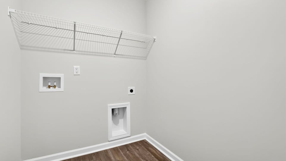 Laundry room with shelf.