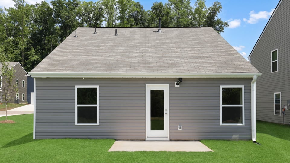 Back exterior with large backyard.