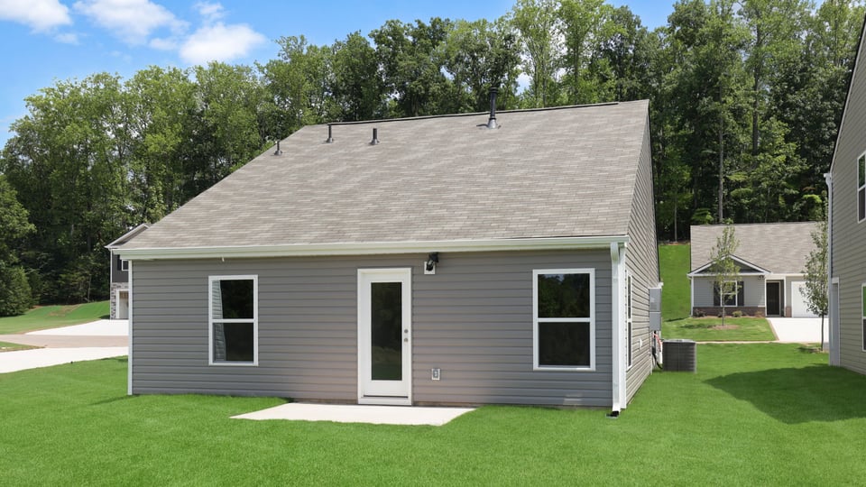 Back exterior with large backyard.