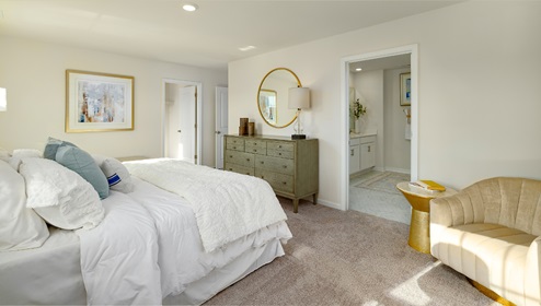 Primary bedroom, carpeted with two large windows