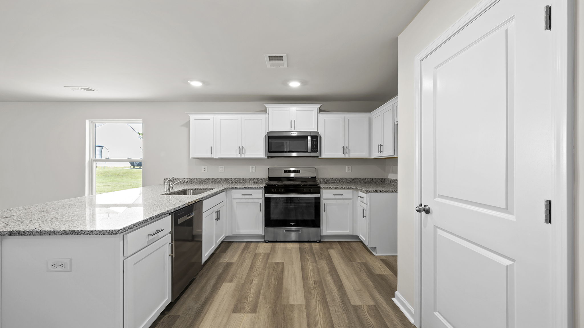 Kitchen with stainless steel appliances.