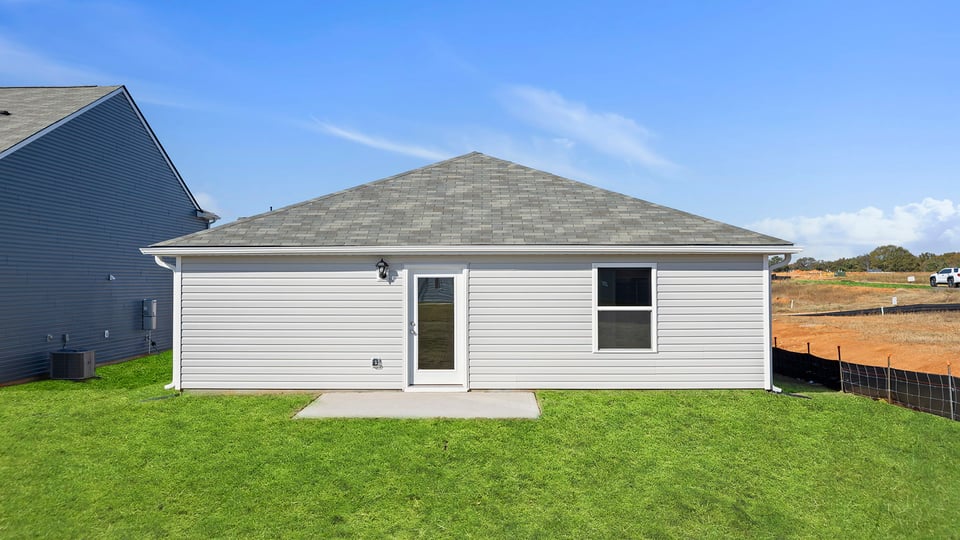 Exterior of home with large bavkyard