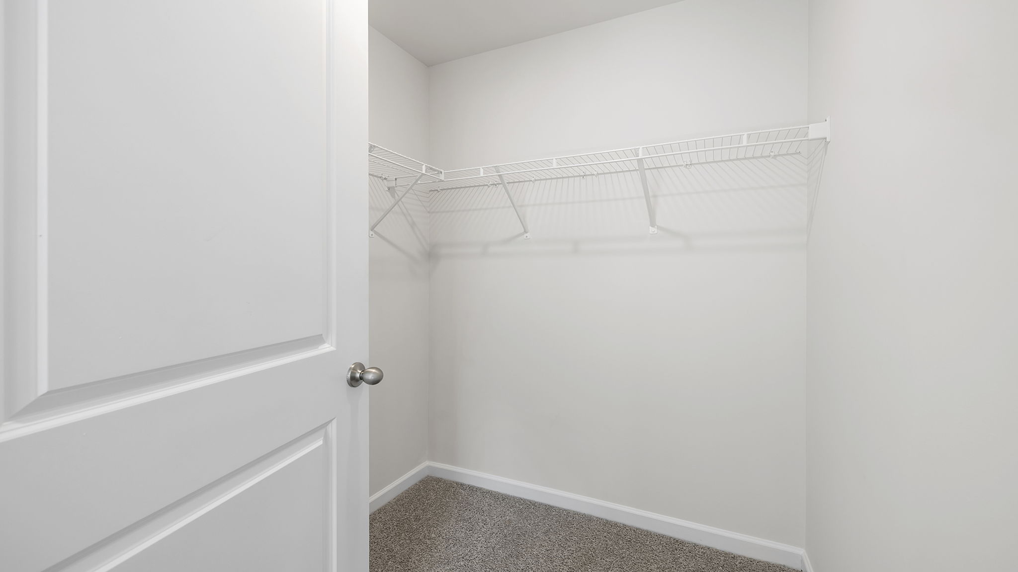 Closet with hanging storage racks.