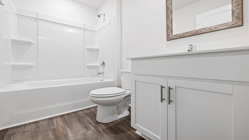 Bathroom with vanity and bathtub.