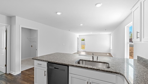 Kitchen and island with granite counter tops.