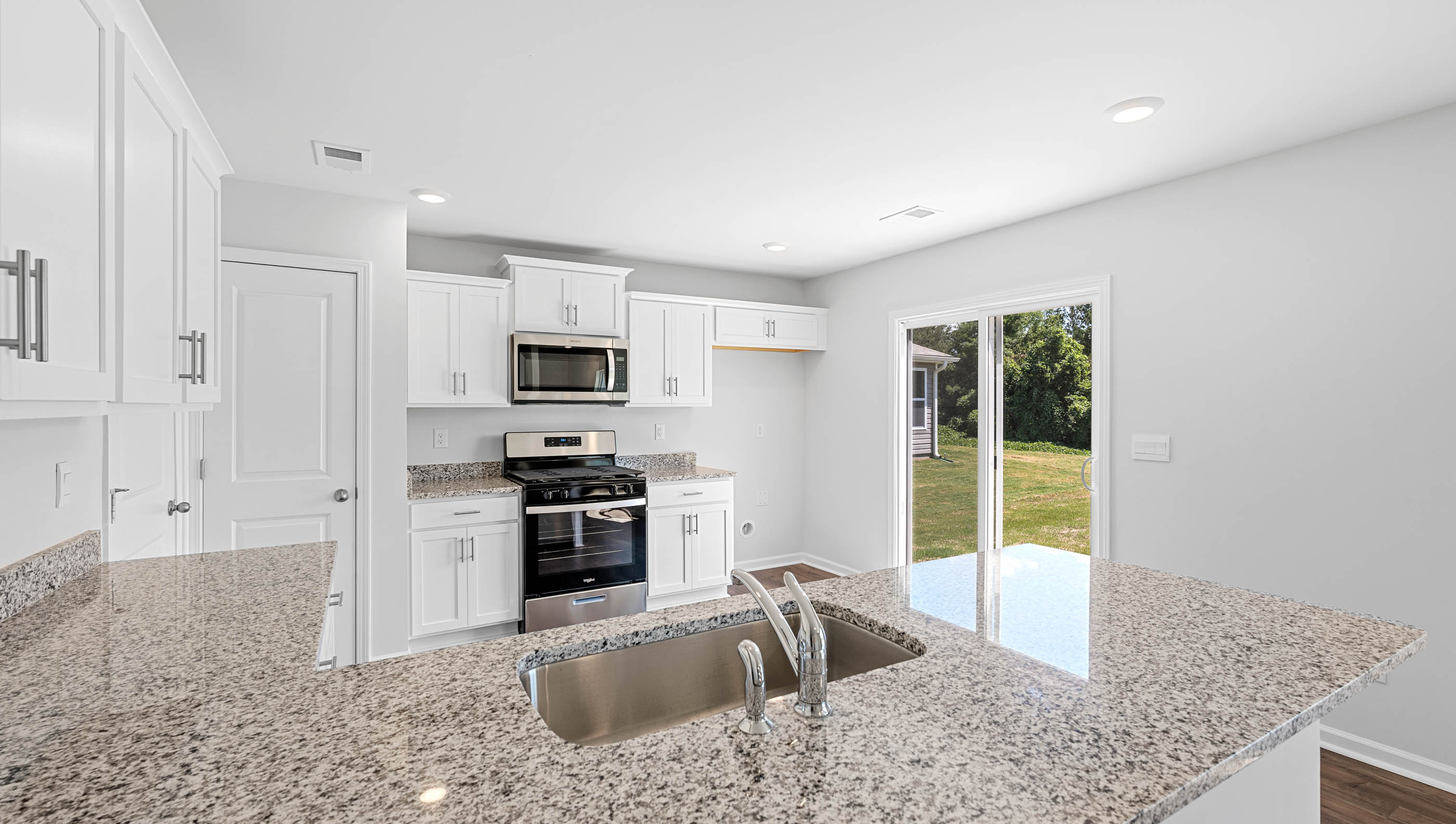 Kitchen with granite counter tops.