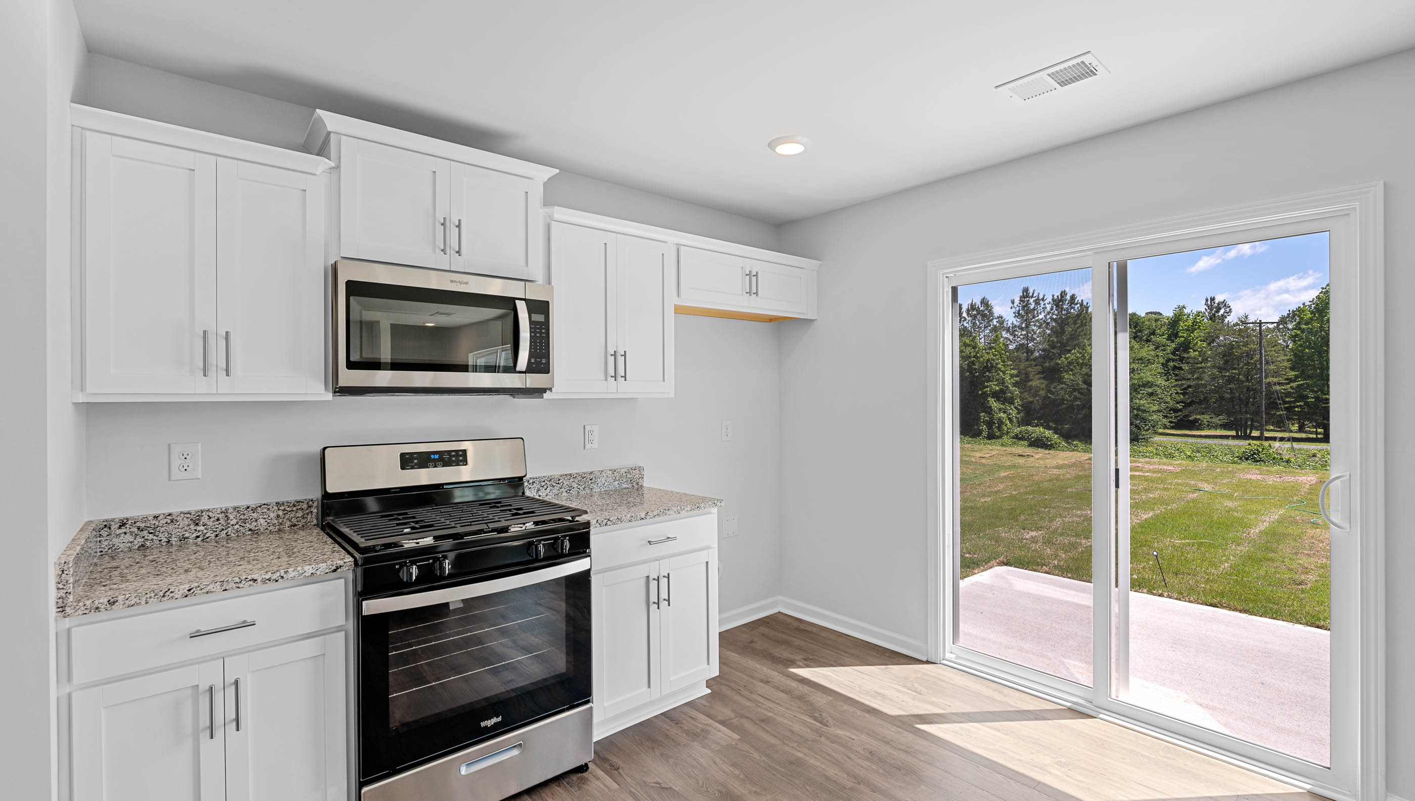 Kitchen with granite counter tops.
