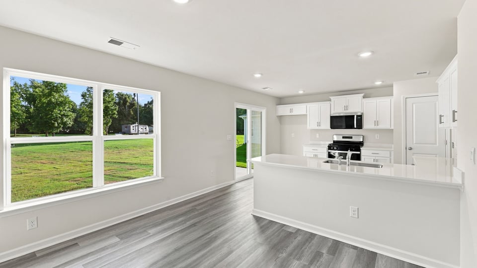 Kitchen with island and cabinets.