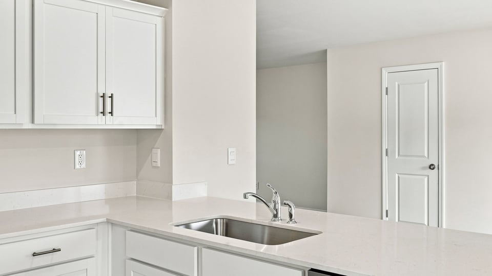 Kitchen with island and cabinets.