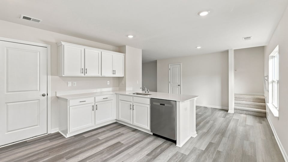 Kitchen with island and cabinets.