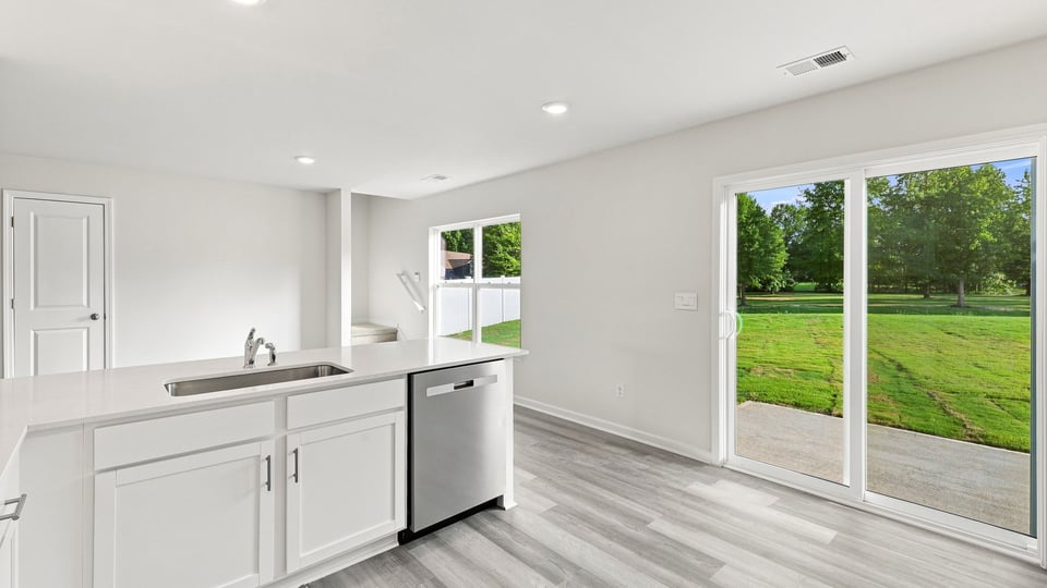 Kitchen with island and cabinets.