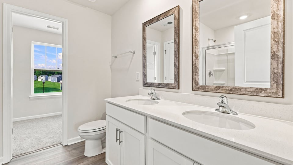 Primary bathroom with double vanity sinks.
