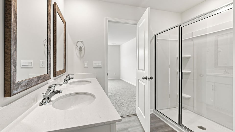 Primary bathroom with double vanity sinks.