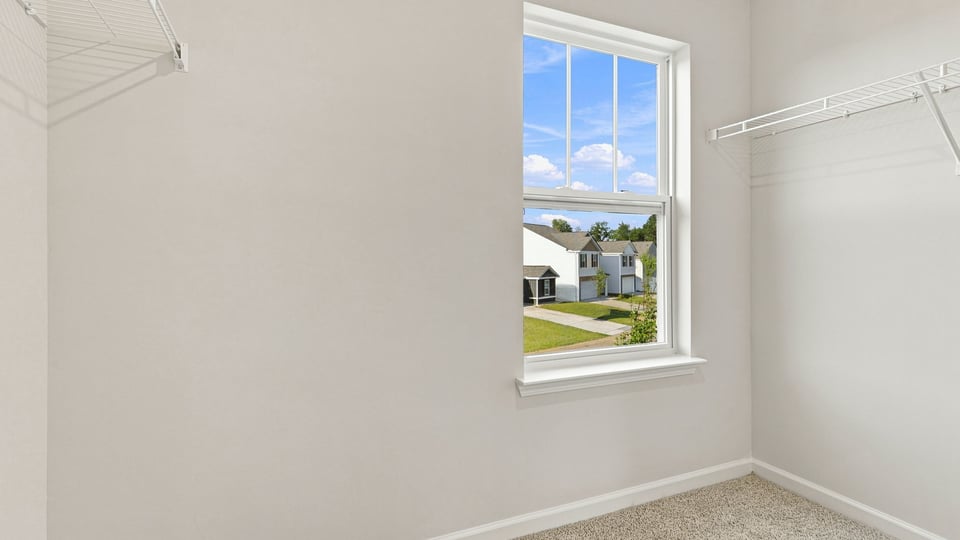 Primary closet with window.