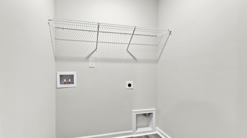 Laundry room with shelf.