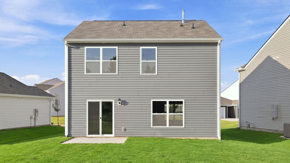 Back exterior with large backyard.