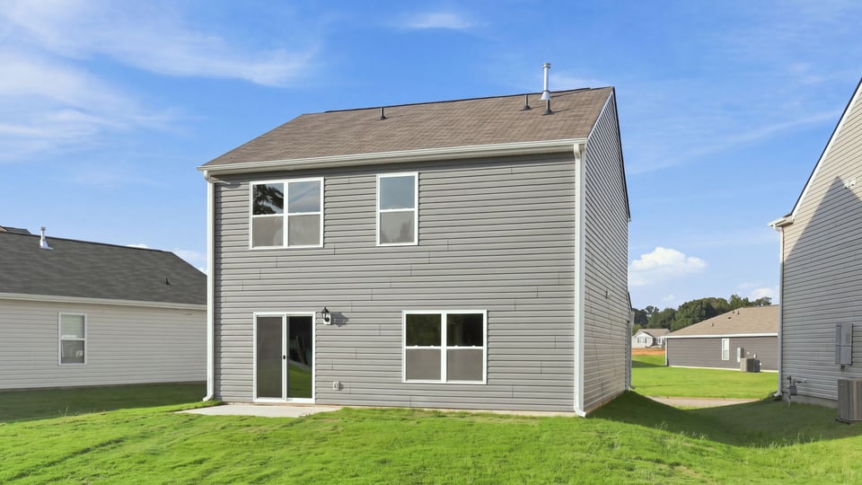 Back exterior with large backyard.