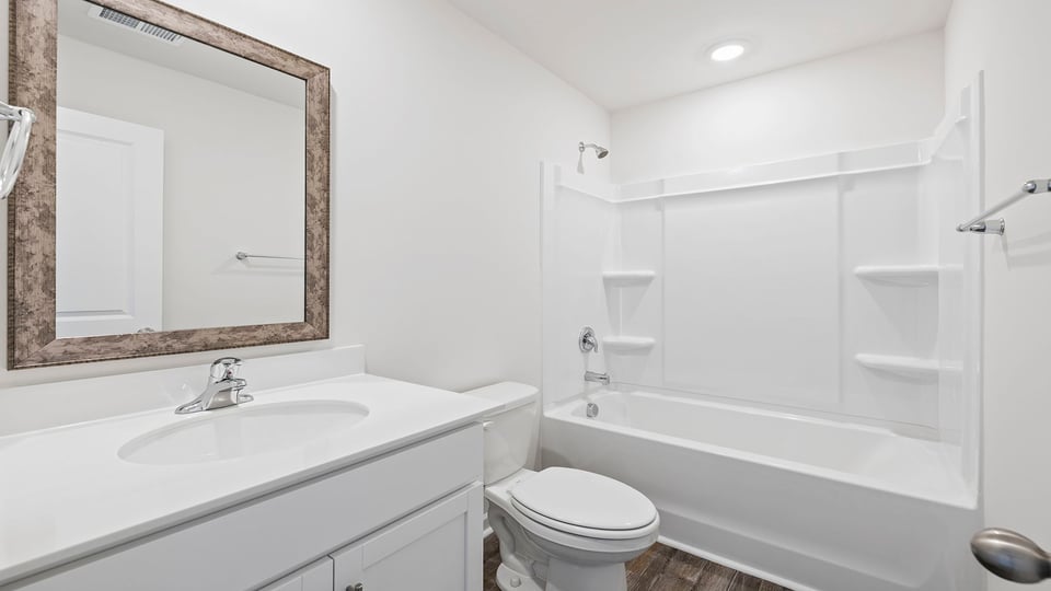 Bathroom with vanity and tub.