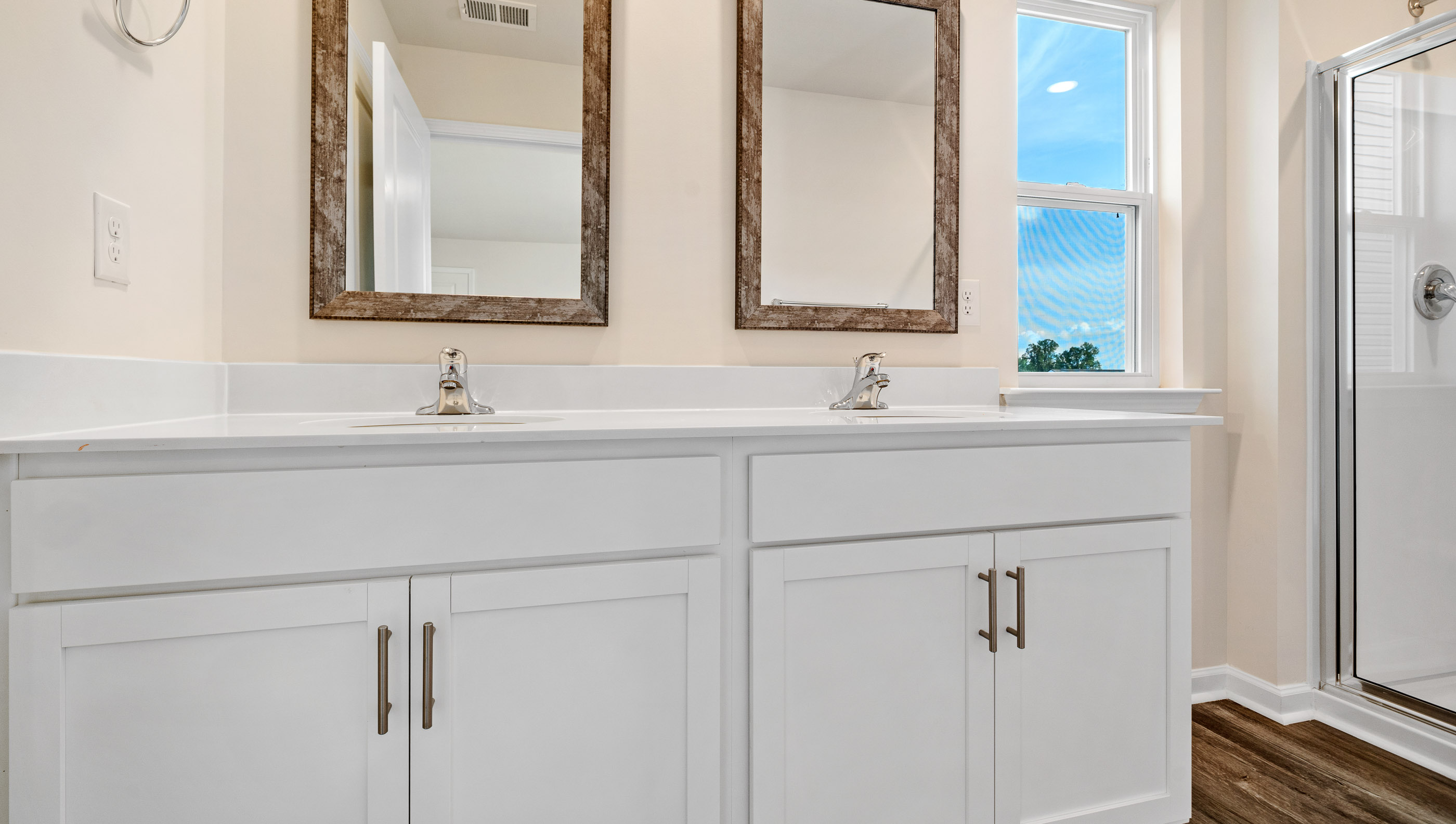 Bathroom with vanity and shower.