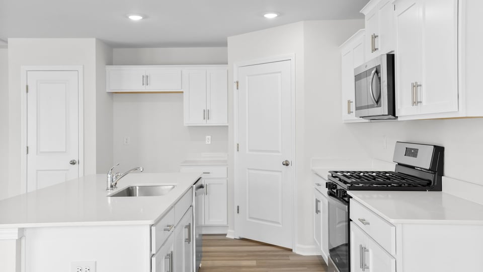 Kitchen with quartz countertops.