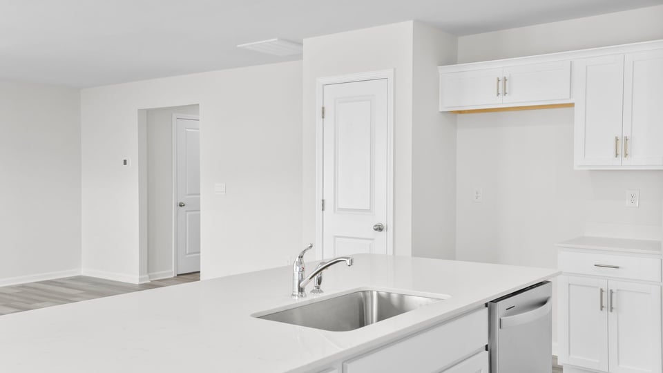 Kitchen with quartz countertops.
