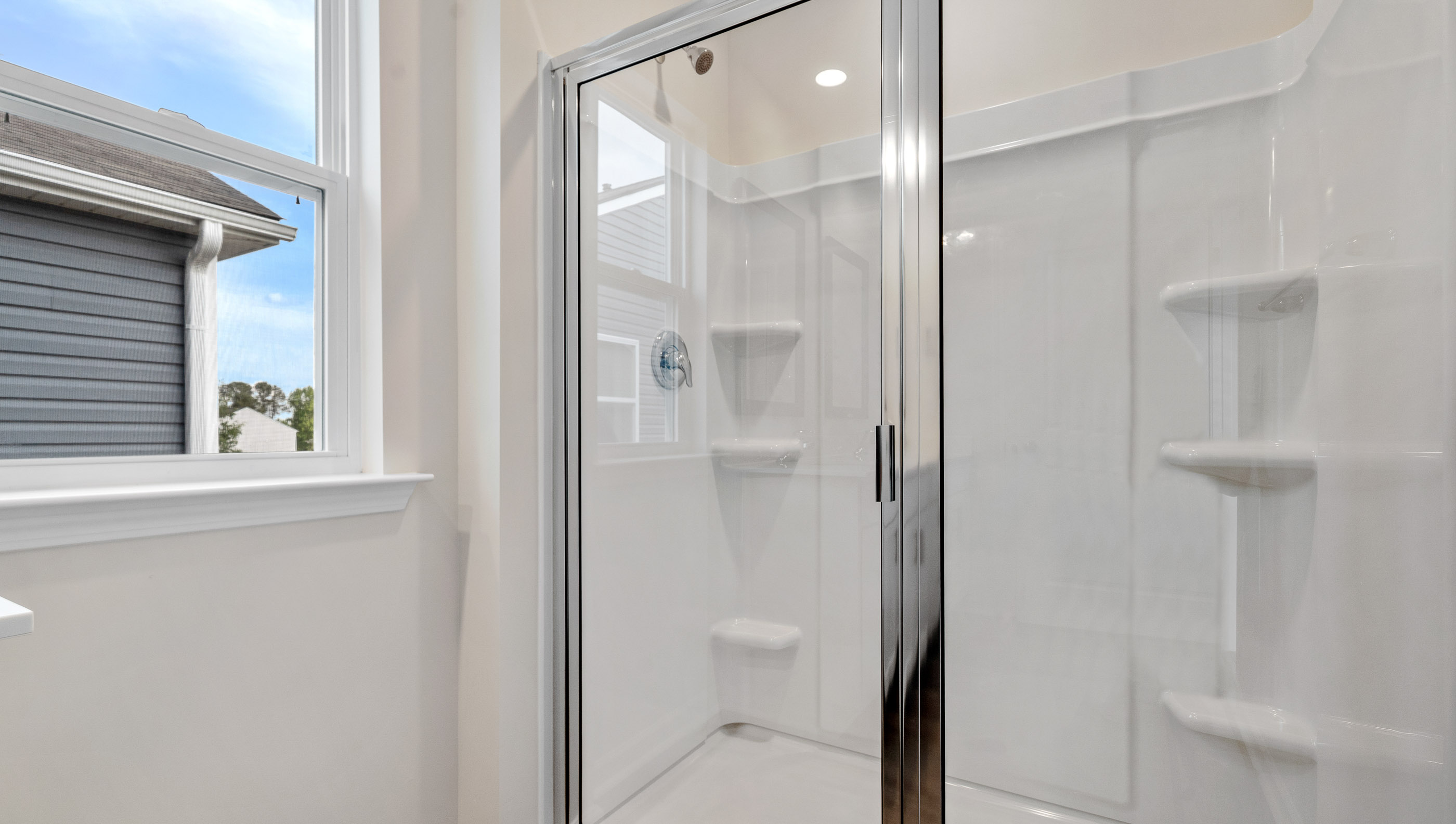 Walk in shower in bathroom.