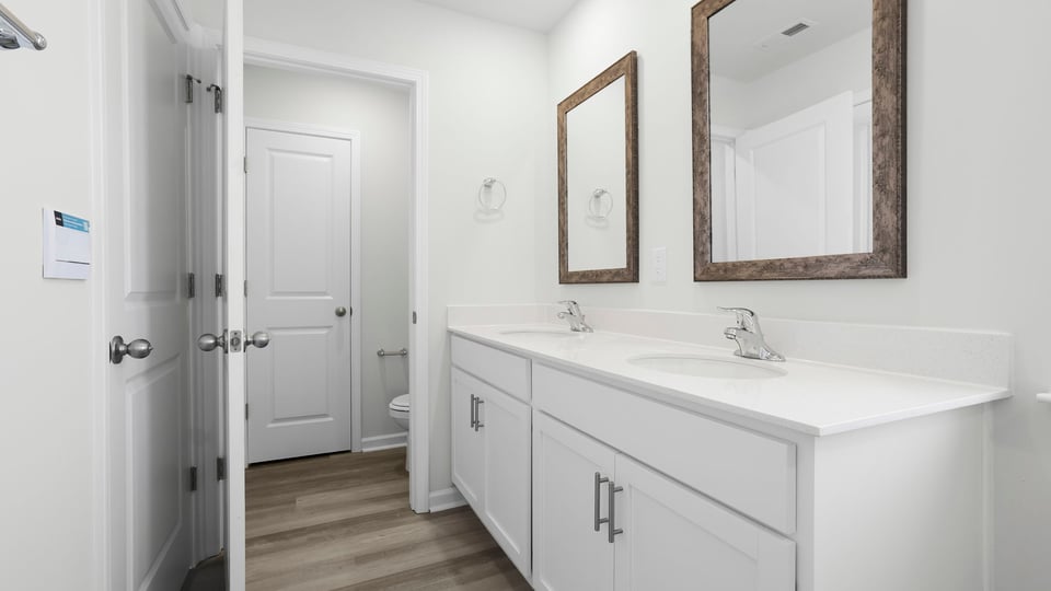 Primary bathroom with double vanity sink.