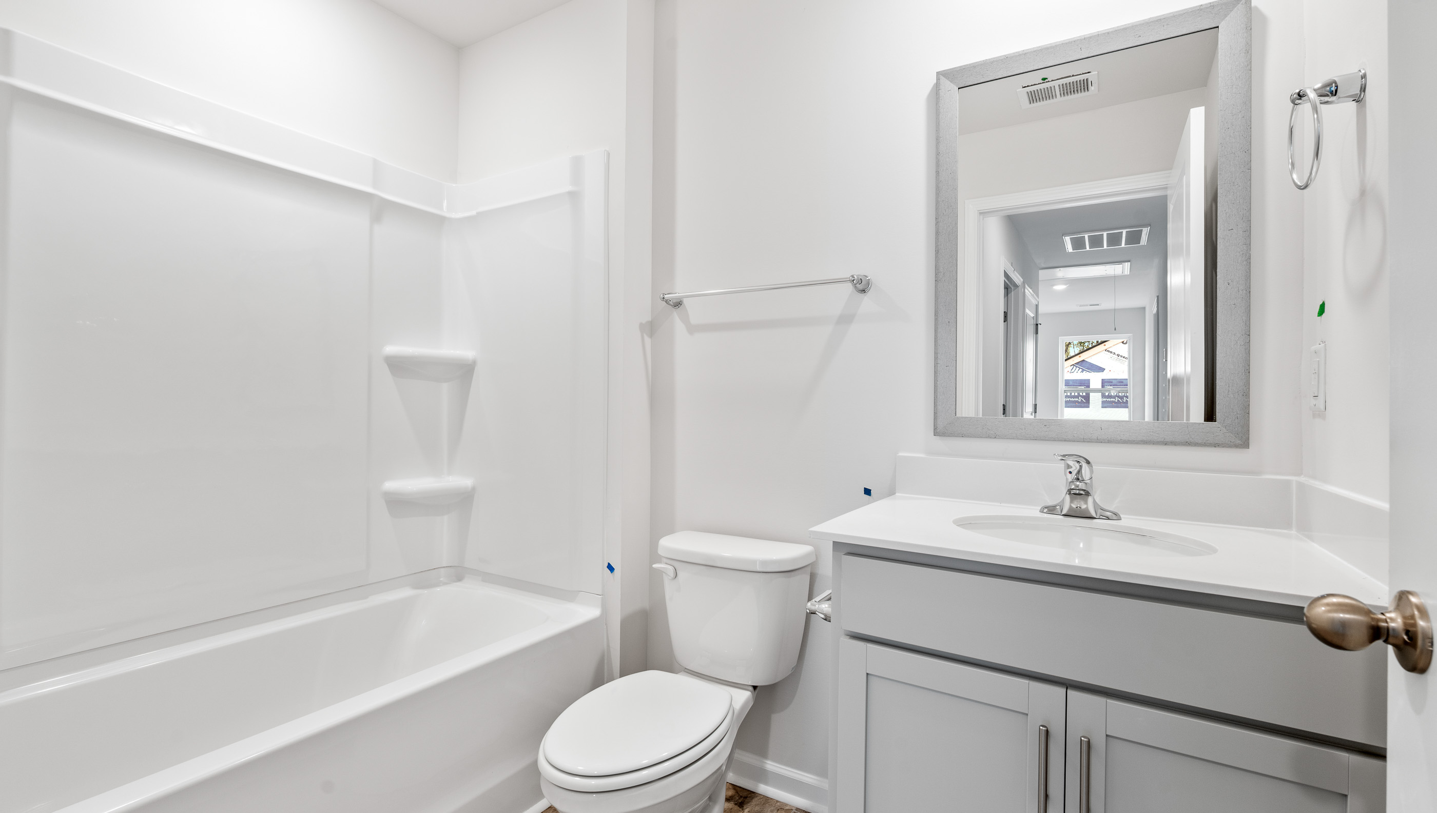 Bathroom with vanity and tub.