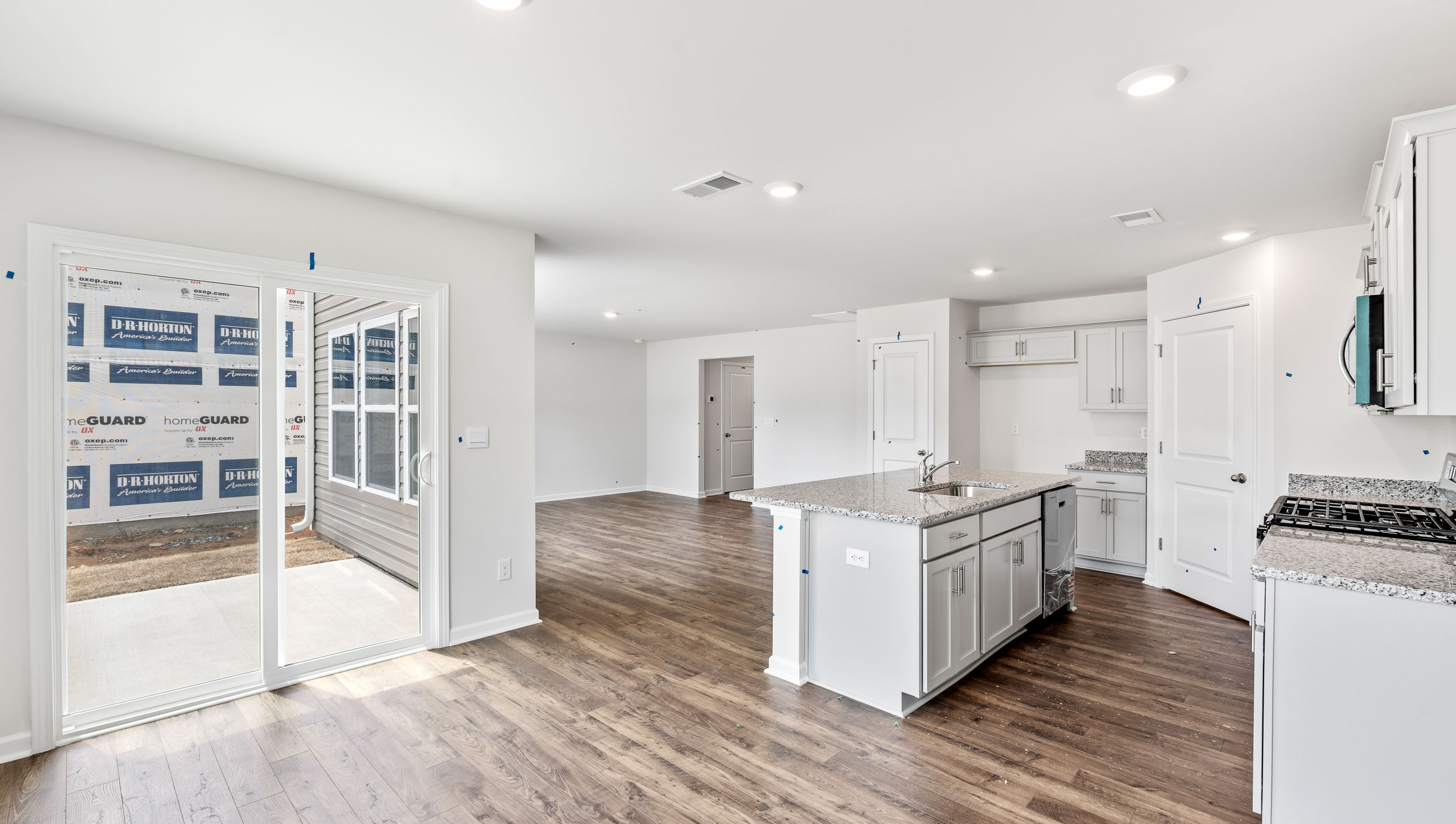 Kitchen and island with granite counter tops.