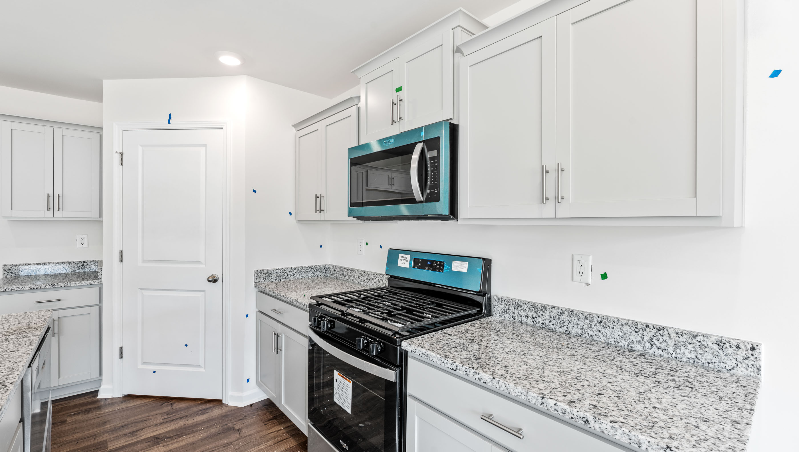 Kitchen and island with granite counter tops.