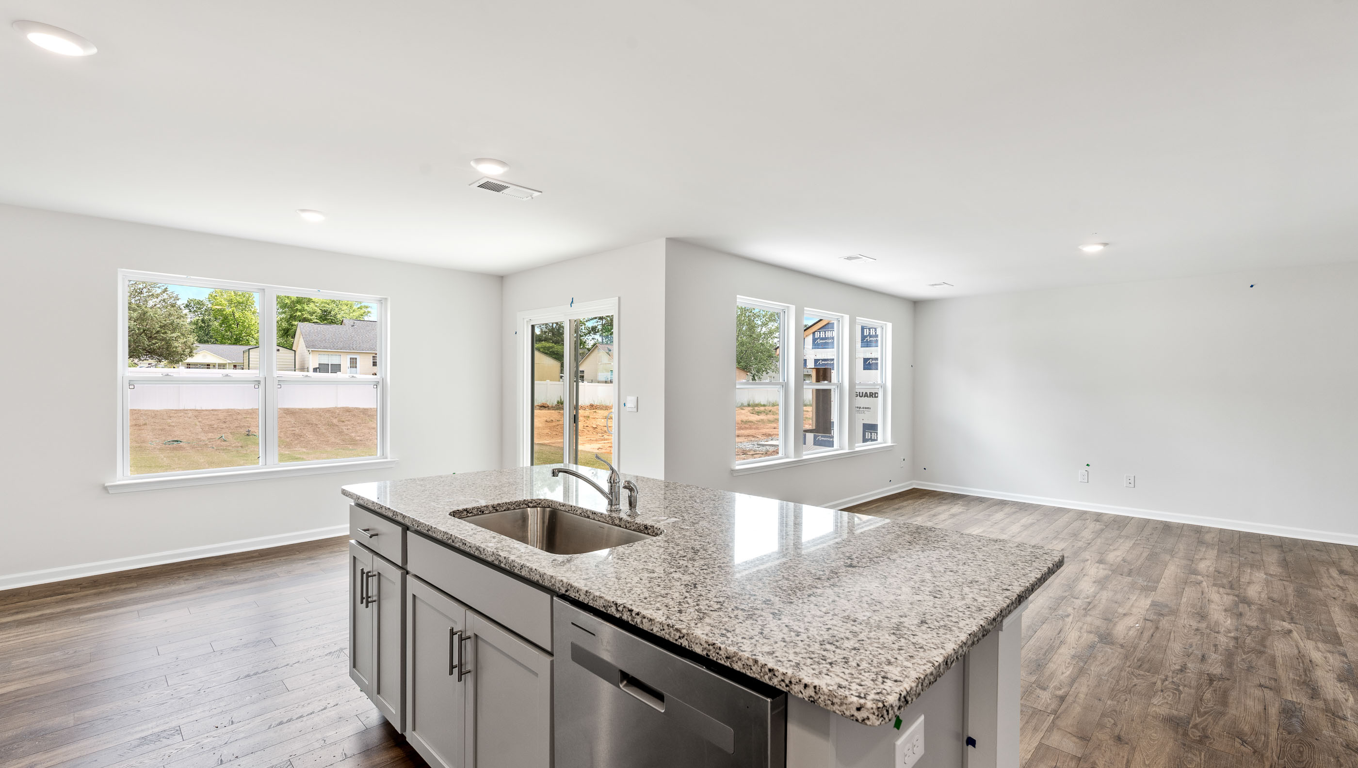 Kitchen and island with granite counter tops.