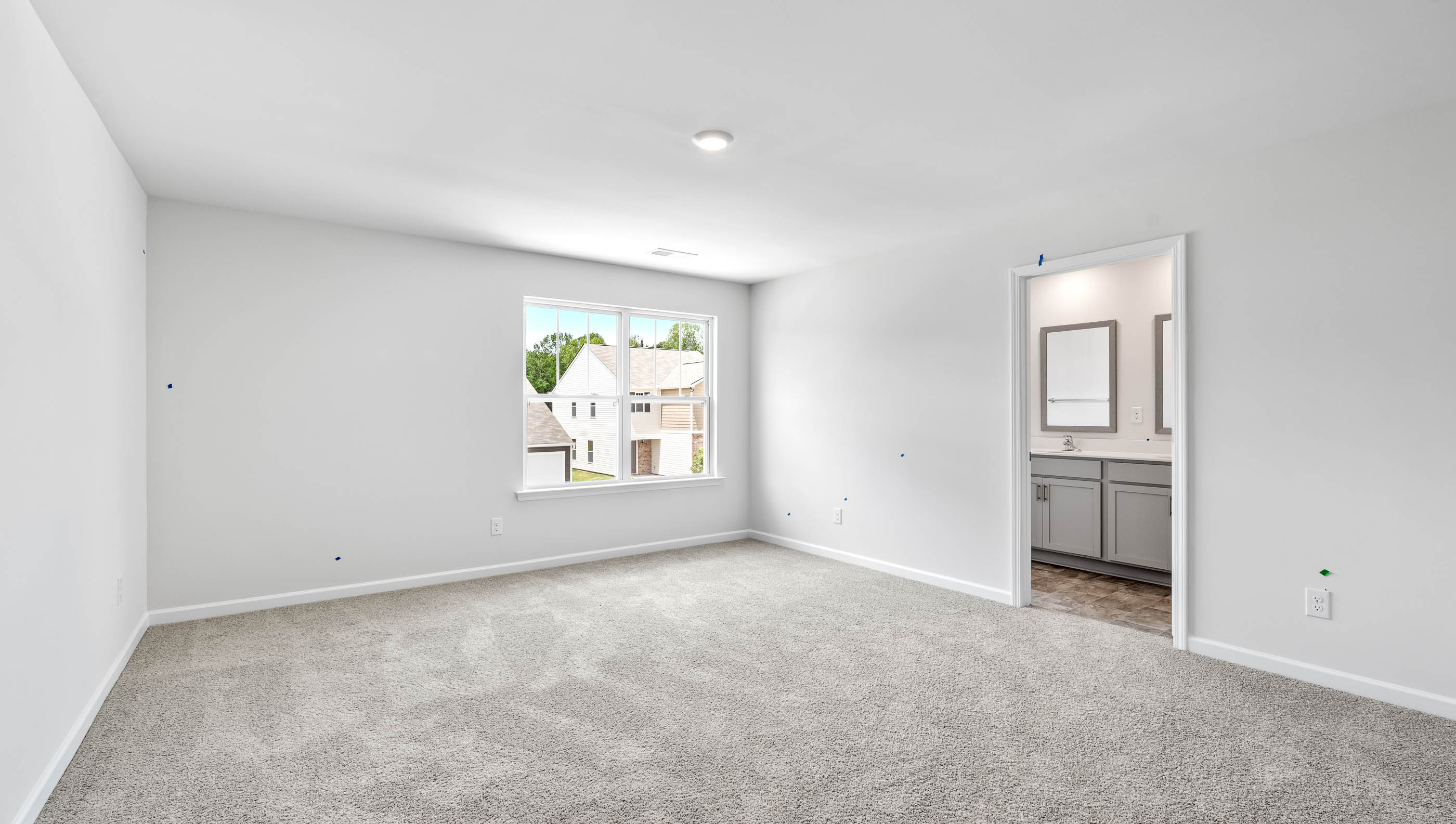 Bedroom with carpet and window.