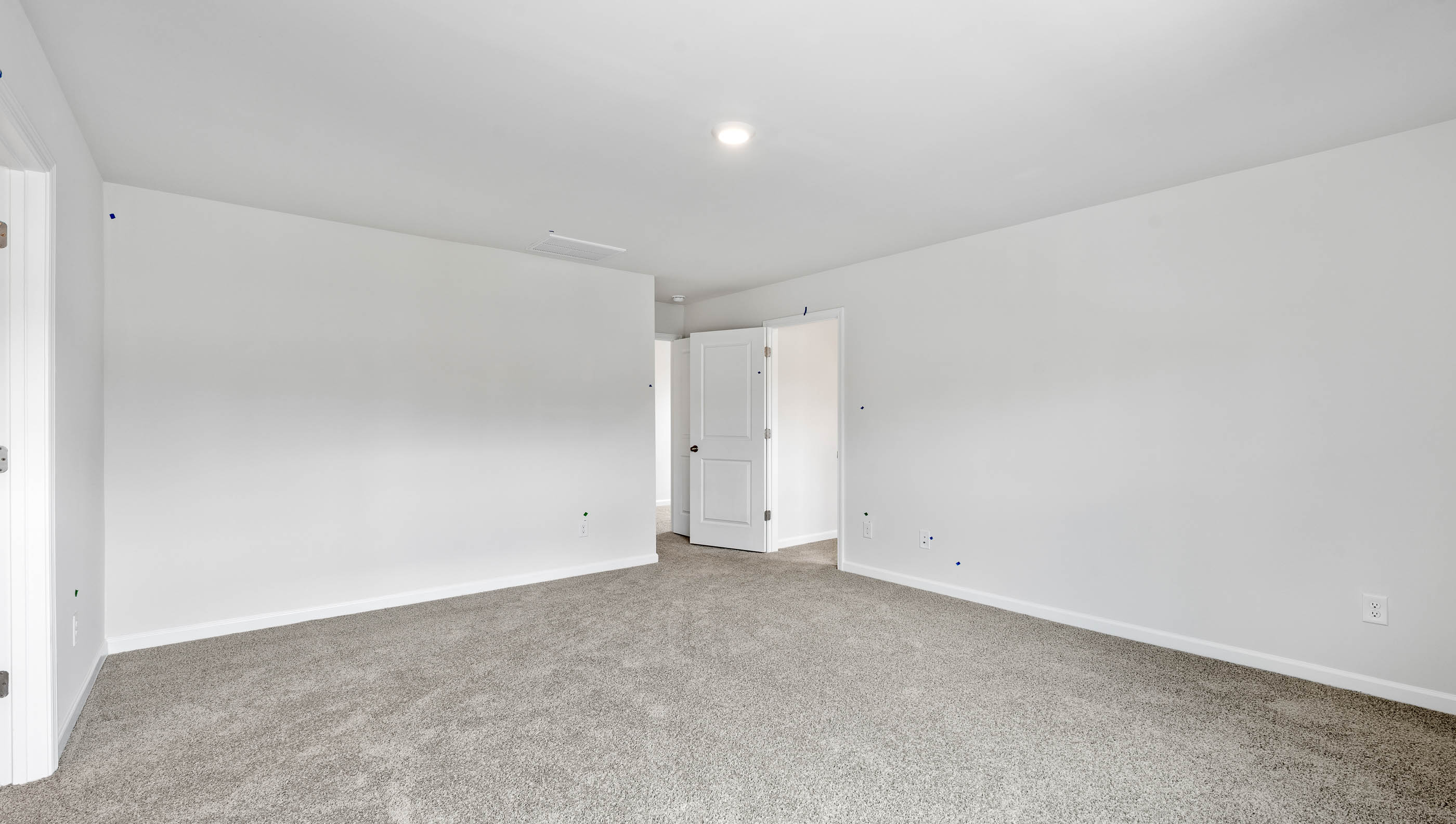 Bedroom with carpet and window.