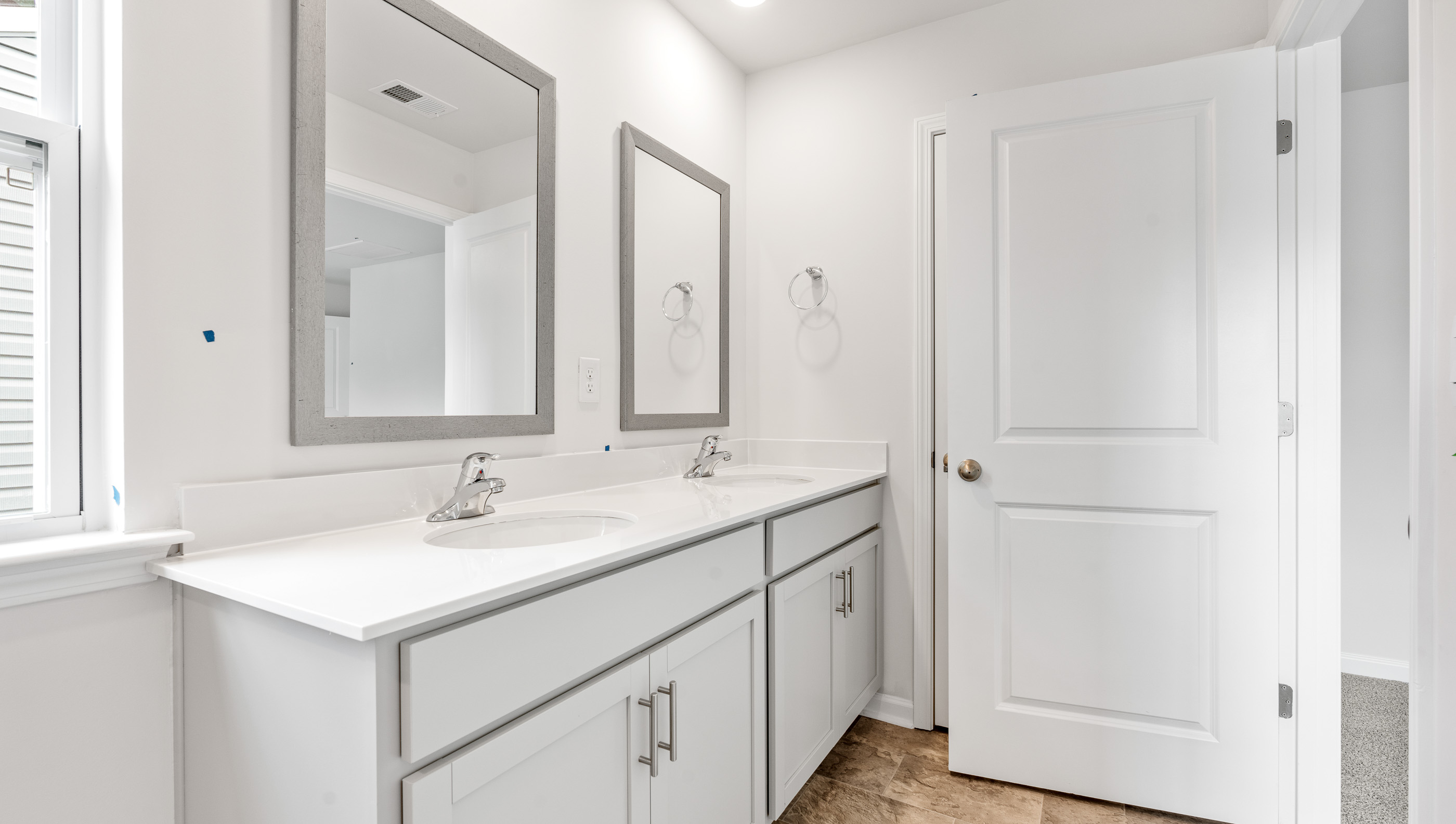 Bathroom with double sink vanity .