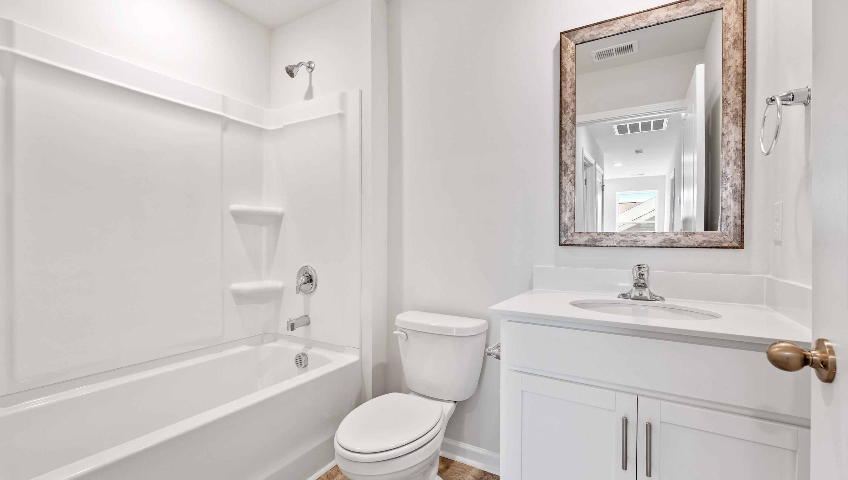Bathroom with vanity and bathtub.