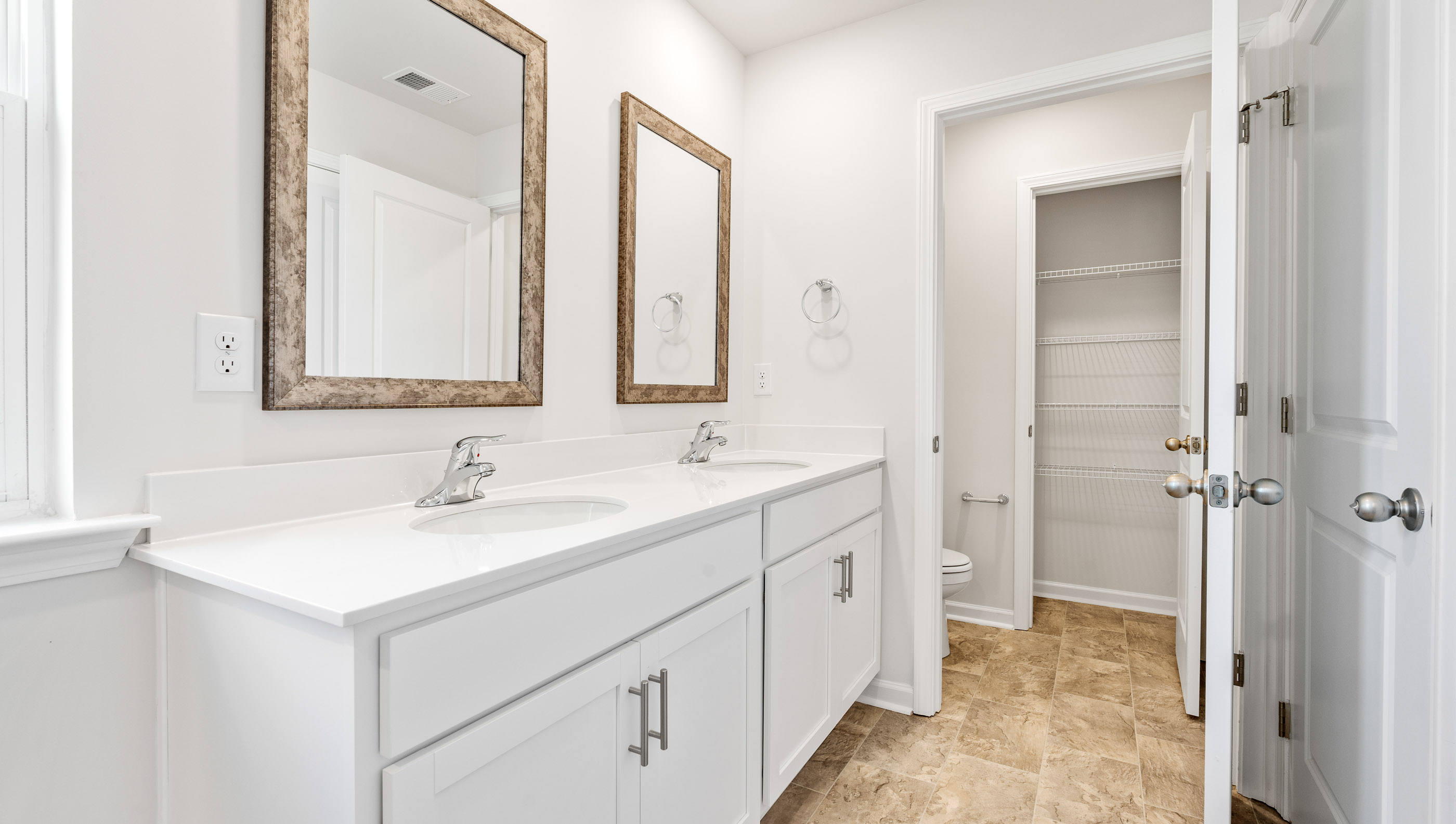 Bathroom with dual vanity.