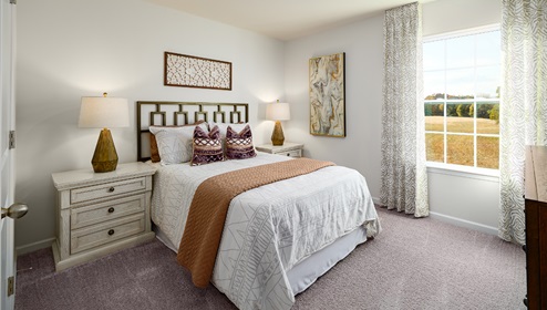 Carpeted bedroom with large window