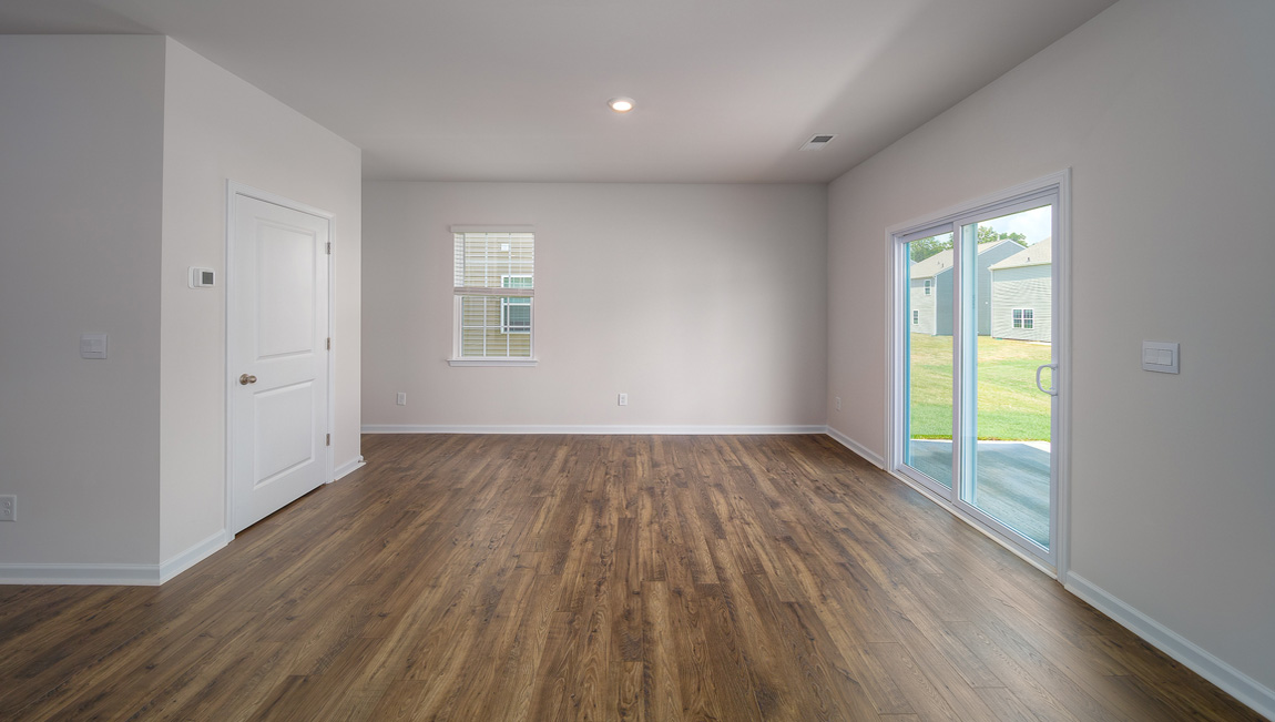 Dining area with vinyl floor and sliding glass door