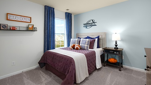 Carpeted bedroom with small window