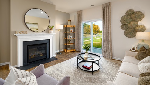 Family room with fireplace and large window