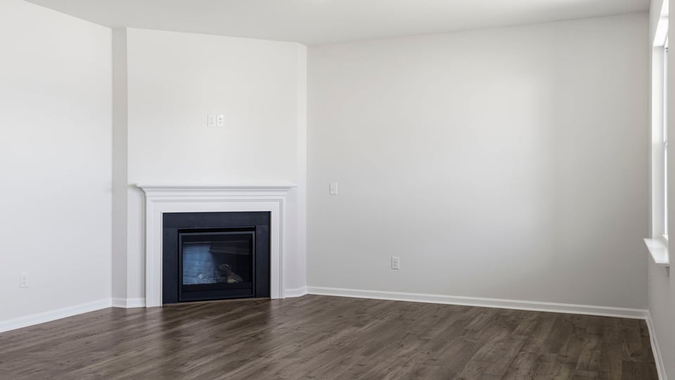 Livingroom with fireplace and window.