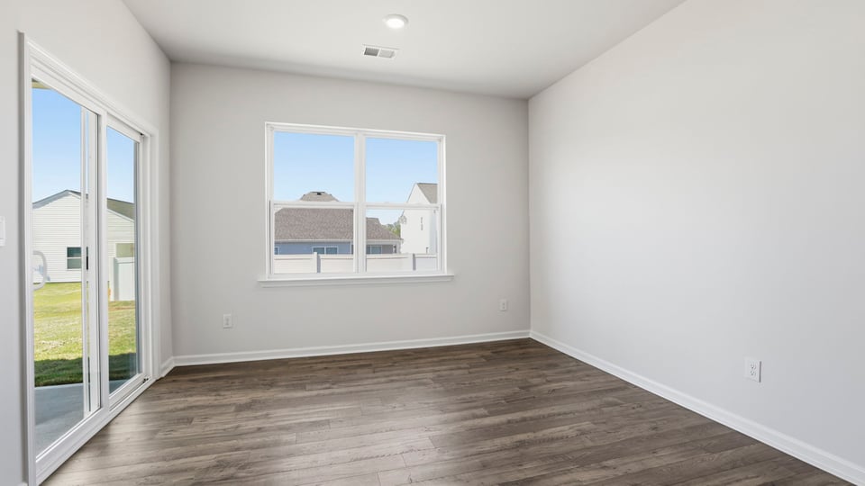 Dining room with window and siding doors.